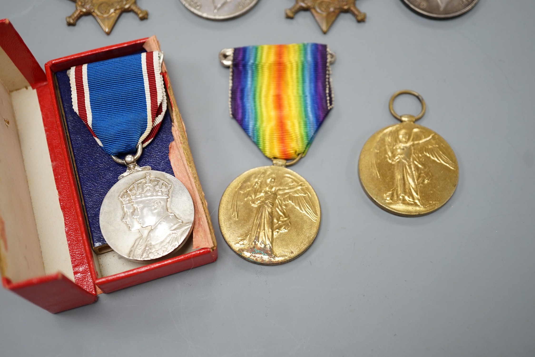 WWI and later medals - Mons star (with bar and rosette) trio to 6480 PTE. F. TURNER 1/DNS., a Mons star pair to L-8608 CPL. E.T. DYER. 1/R W. KENT R., an unnamed Great War medal and a boxed George VI coronation medal (7)